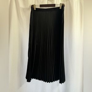 Pack of H&M skirts- black and cream size XL. Gently worn.